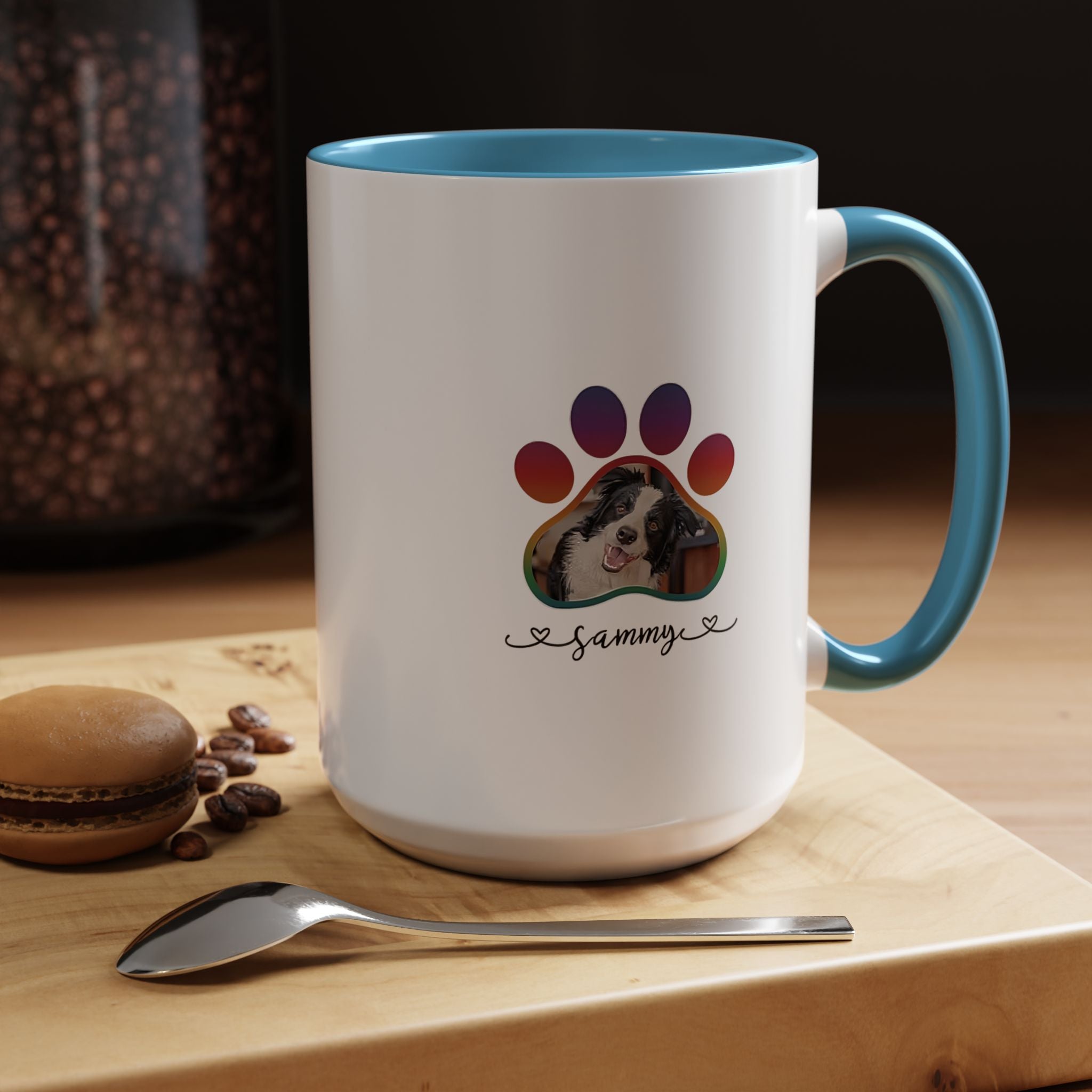 Custom pet photo mug with a paw print design and personalized dog name on white ceramic with orange handle.

