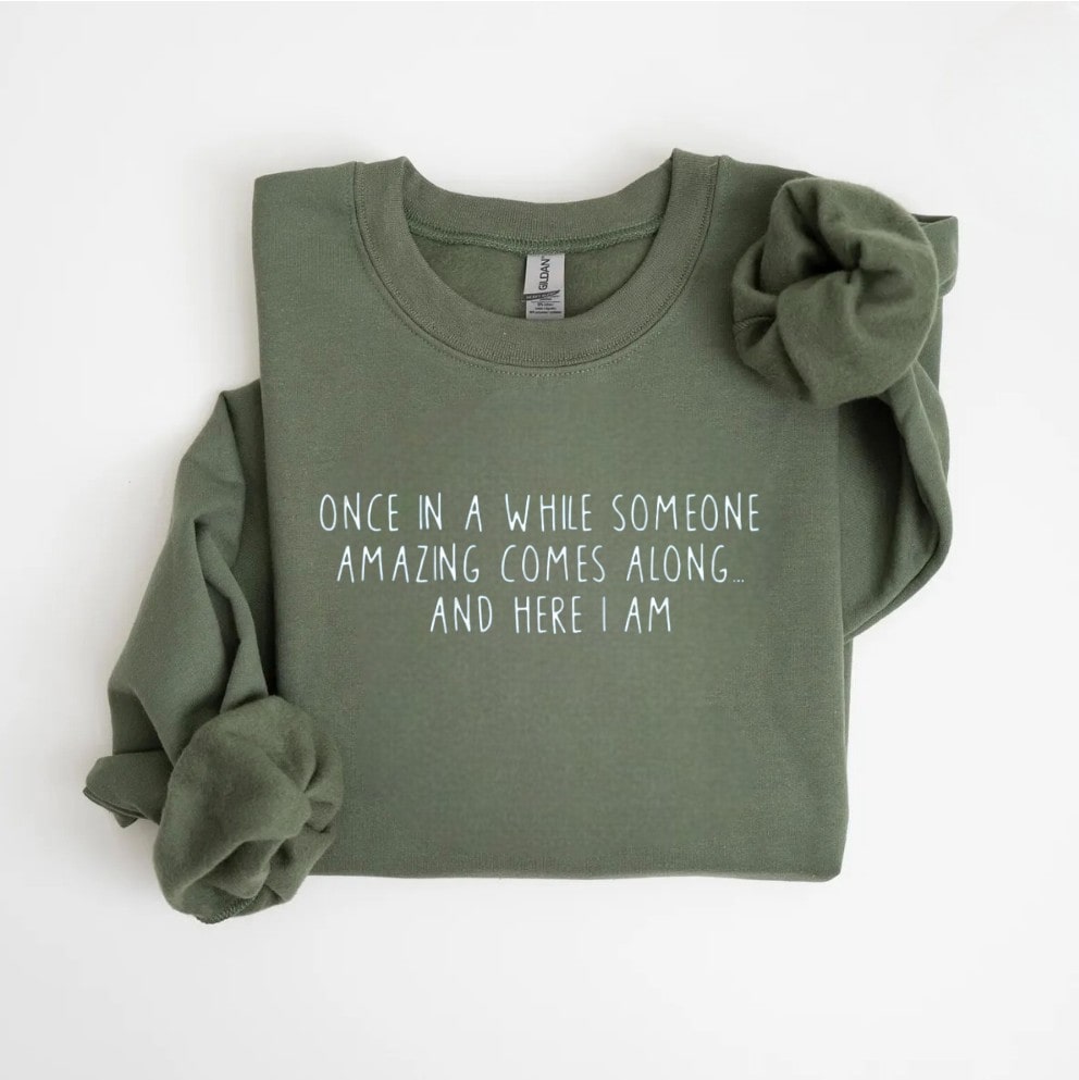 Green sweatshirt with empowering message, perfect for self-love.