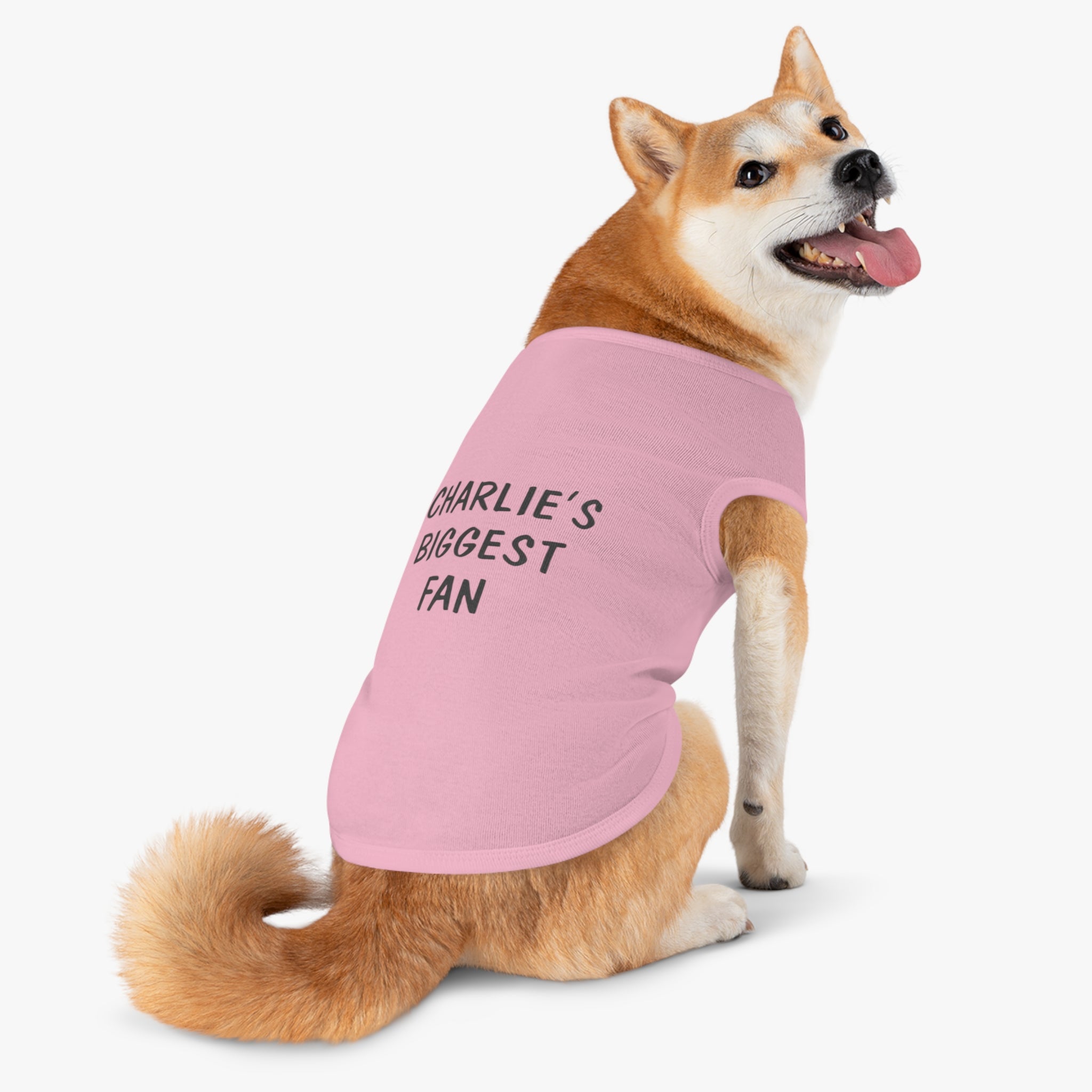 Pink "Biggest Fan" customizable dog t-shirt on a Shiba Inu.