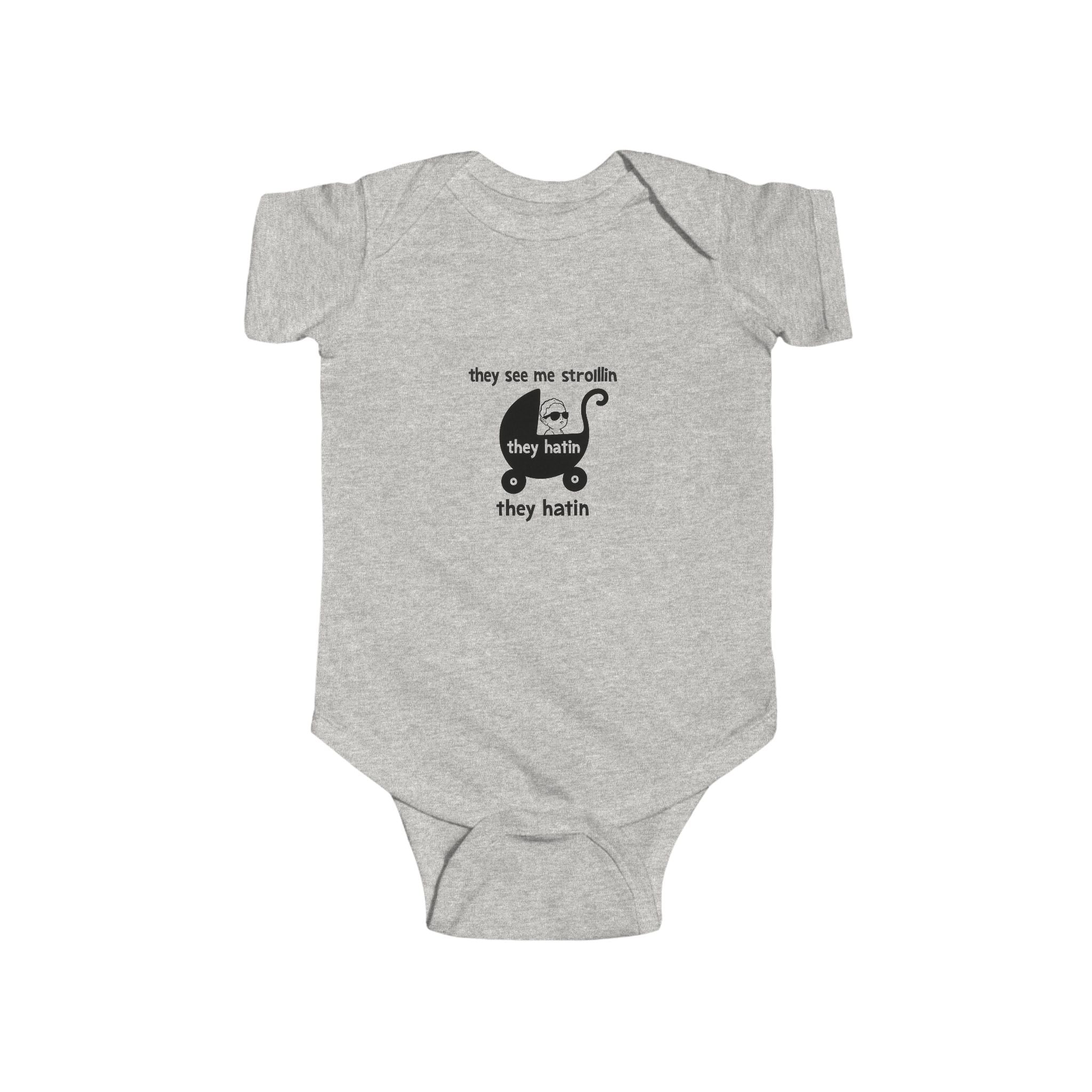 Gray baby onesie with “they see me strollin’ they hatin’” meme design and stroller graphic