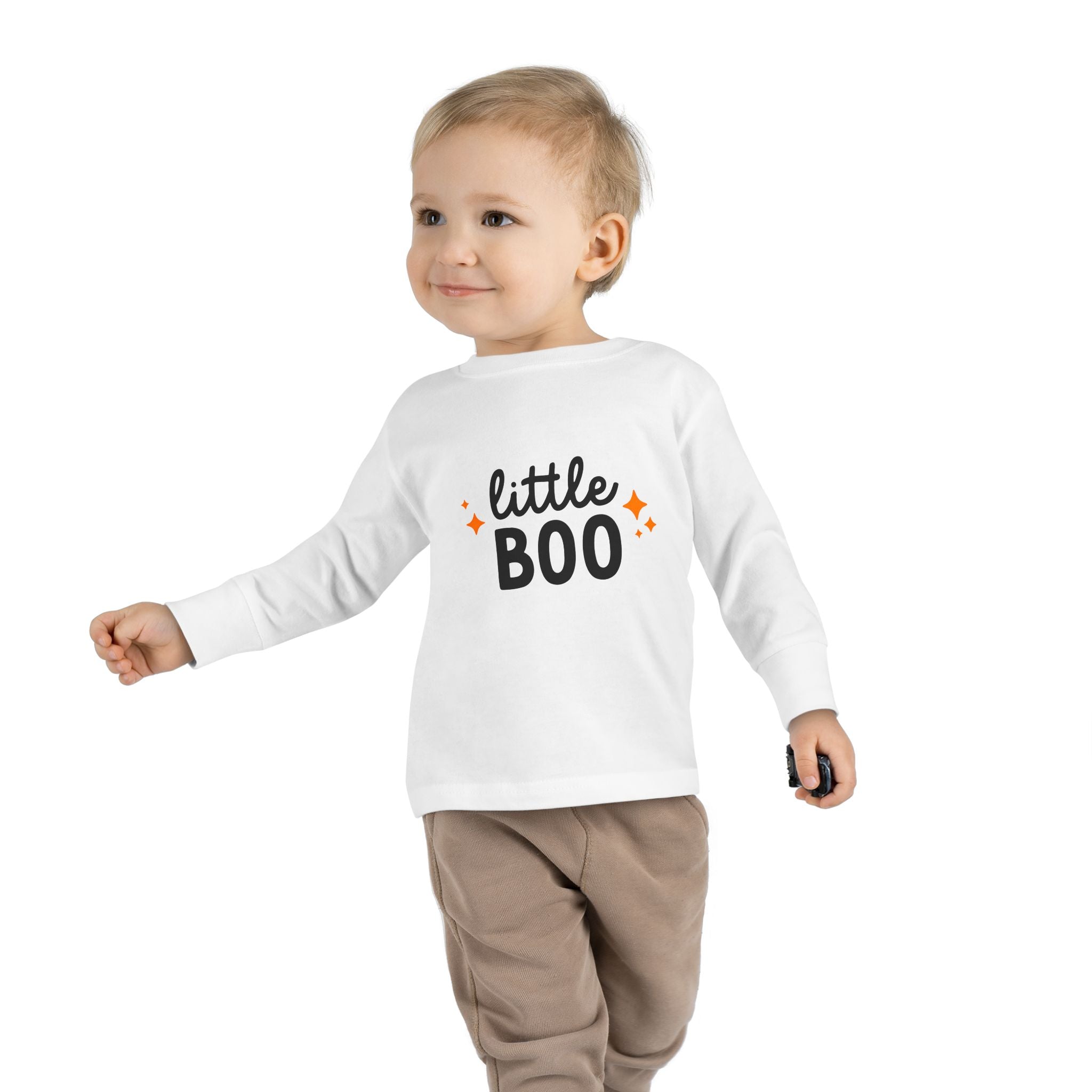 Toddler boy in white Little Boo shirt running happily
