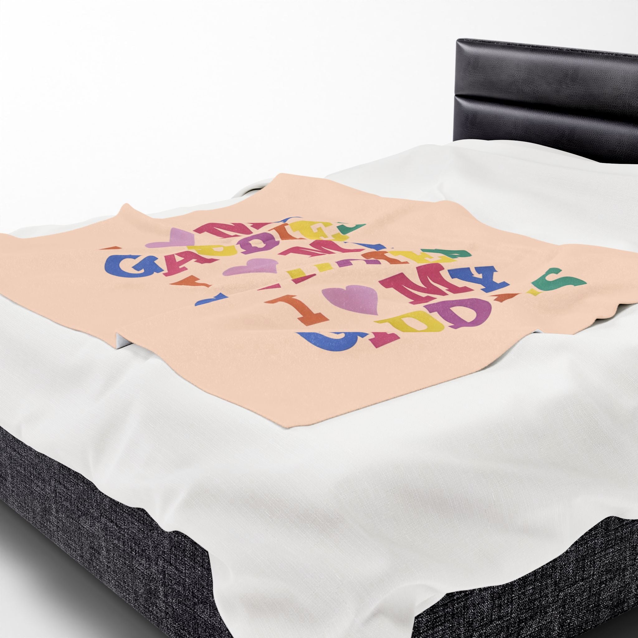 Colorful throw blanket on bed featuring bold rainbow text that says “I Love My Gaddies” – perfect LGBTQ+ gift for chosen family and pride celebrations.

