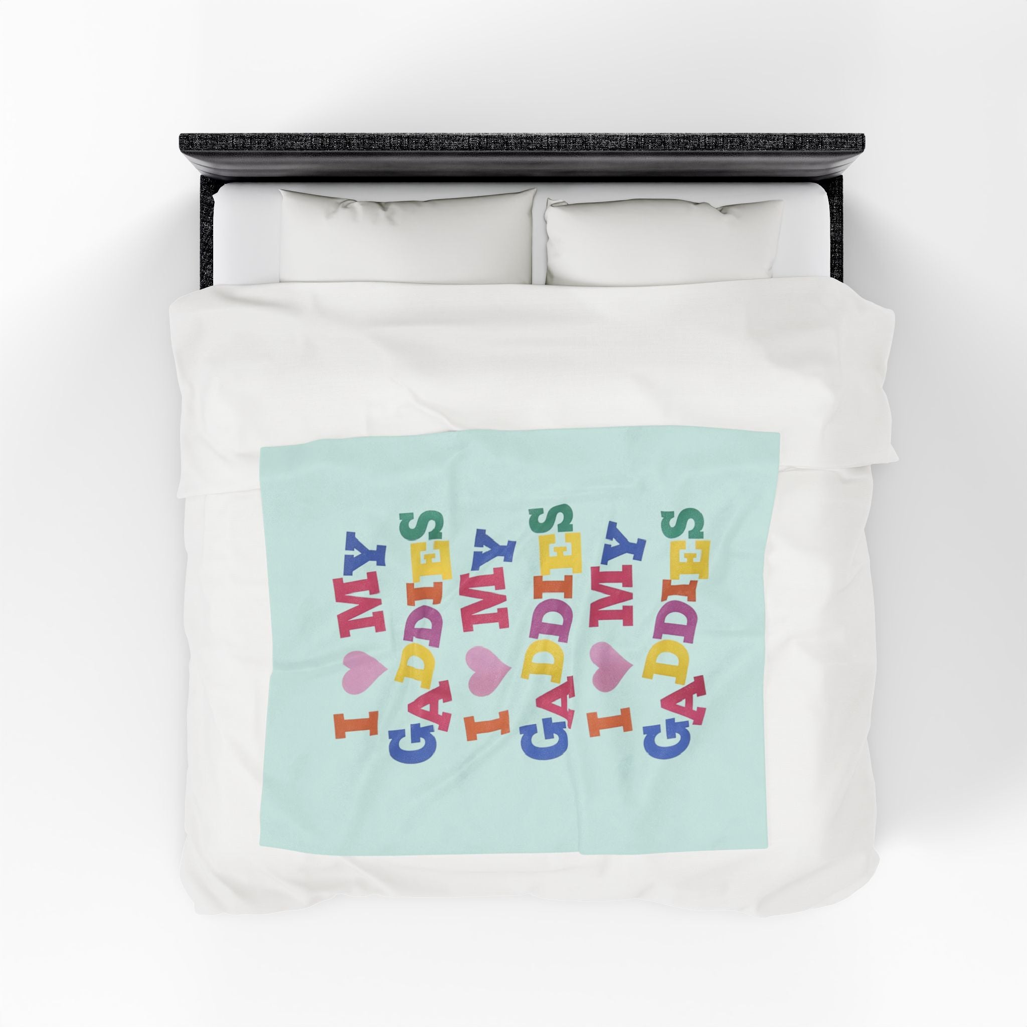 Colorful throw blanket on bed featuring bold rainbow text that says “I Love My Gaddies” – perfect LGBTQ+ gift for chosen family and pride celebrations.

