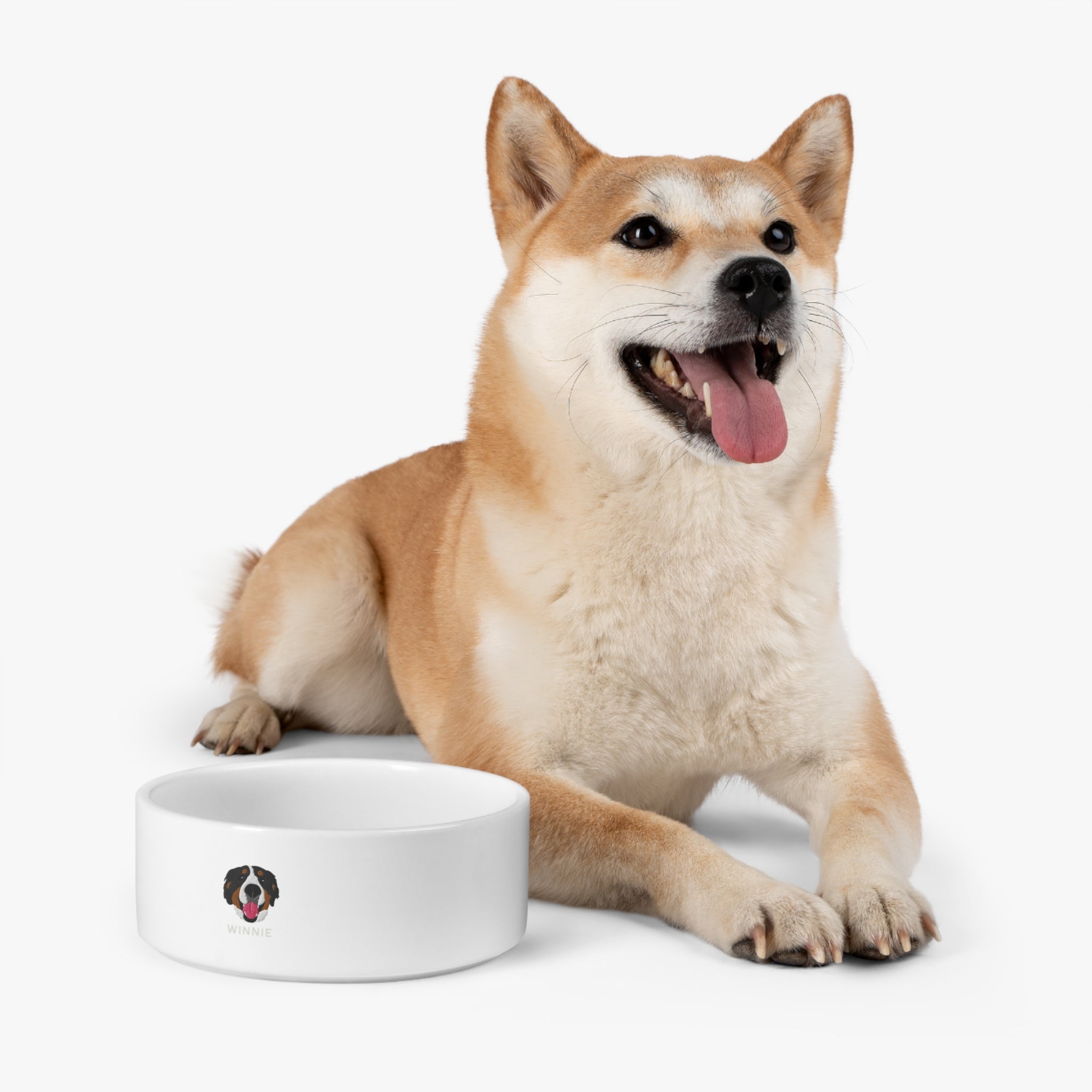 White ceramic custom pet bowl with embroidered-style dog face and the name “Winnie” printed on the front; 16oz capacity with glazed finish.

