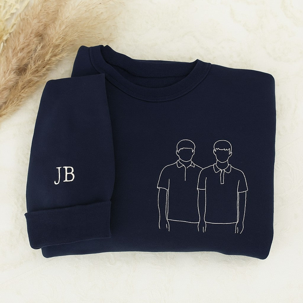 Custom embroidered couple hoodies with minimalist line art portrait design and personalized sleeve initials