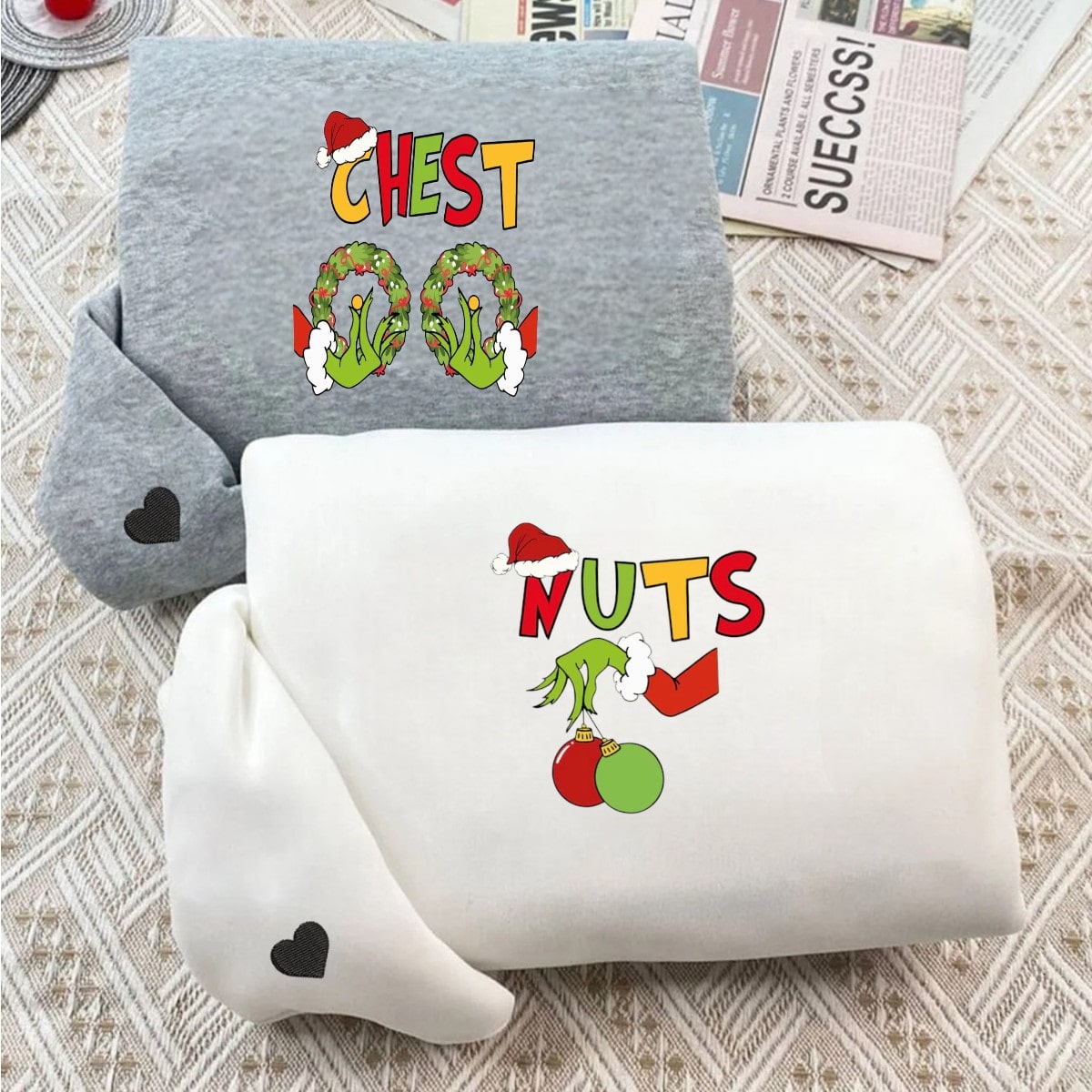 Matching Christmas sweatshirts with "Chest Nuts" festive designs in burgundy and beige.