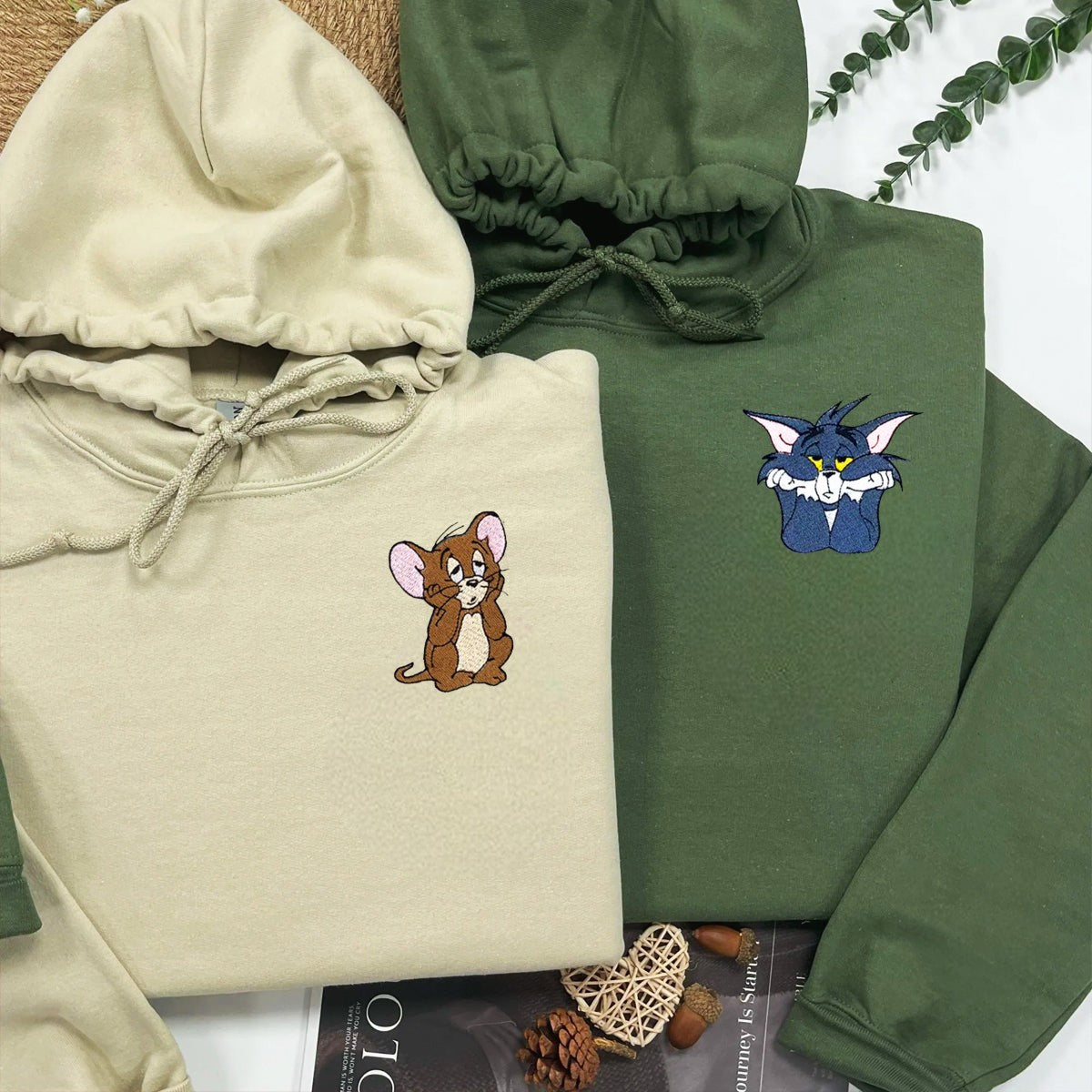 Matching couple hoodies featuring embroidered mouse and cat characters with playful designs.