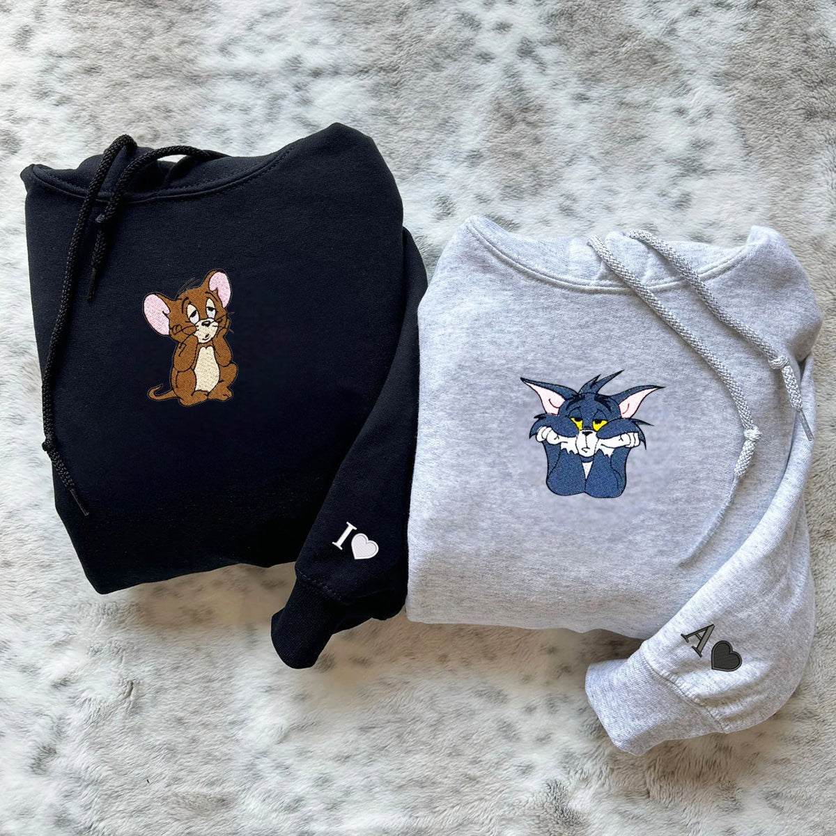 Matching hoodies for couples with mouse and cat embroidered designs.