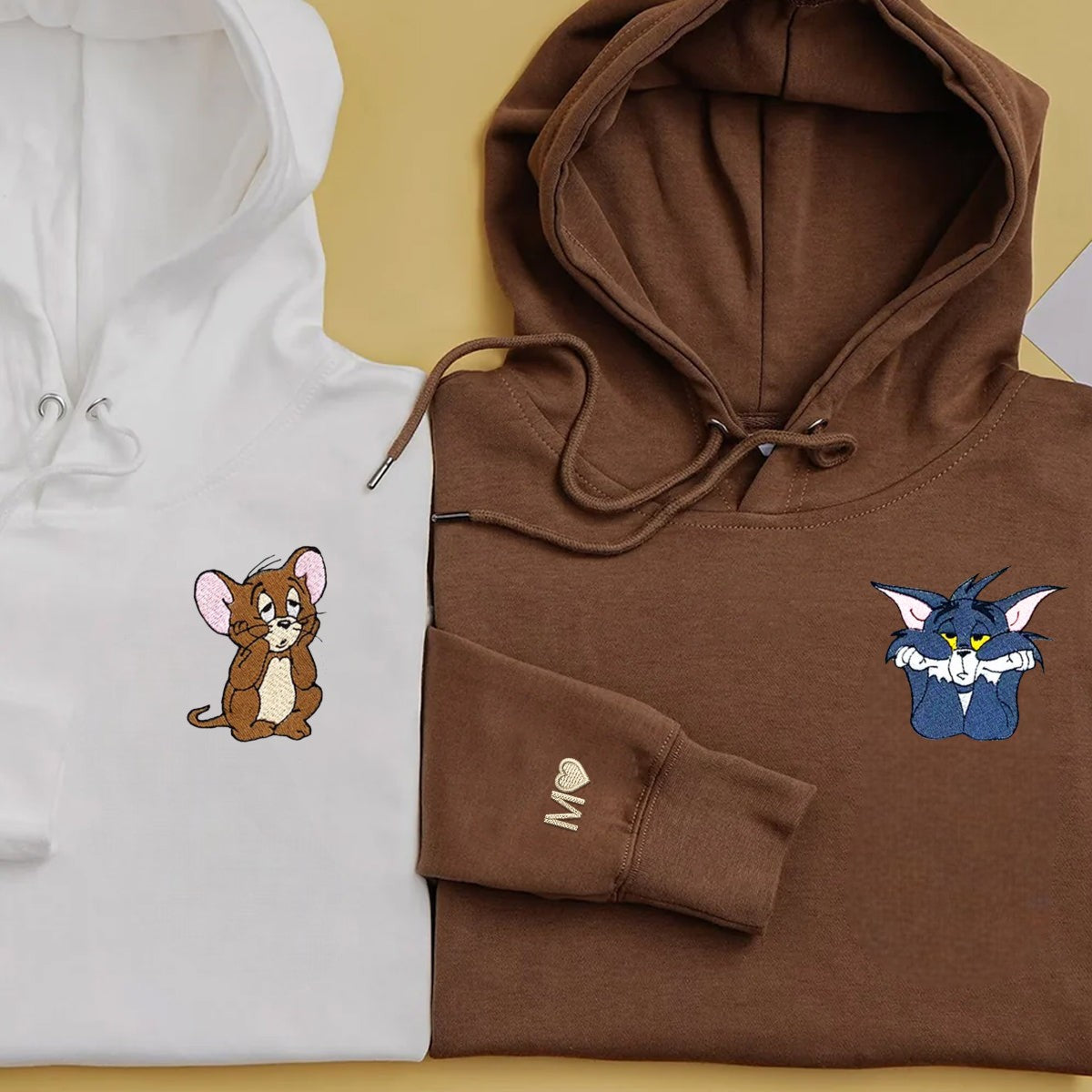 Playful Mouse & Cat Couple Hoodies with cozy fit and charming cartoon embroidery.