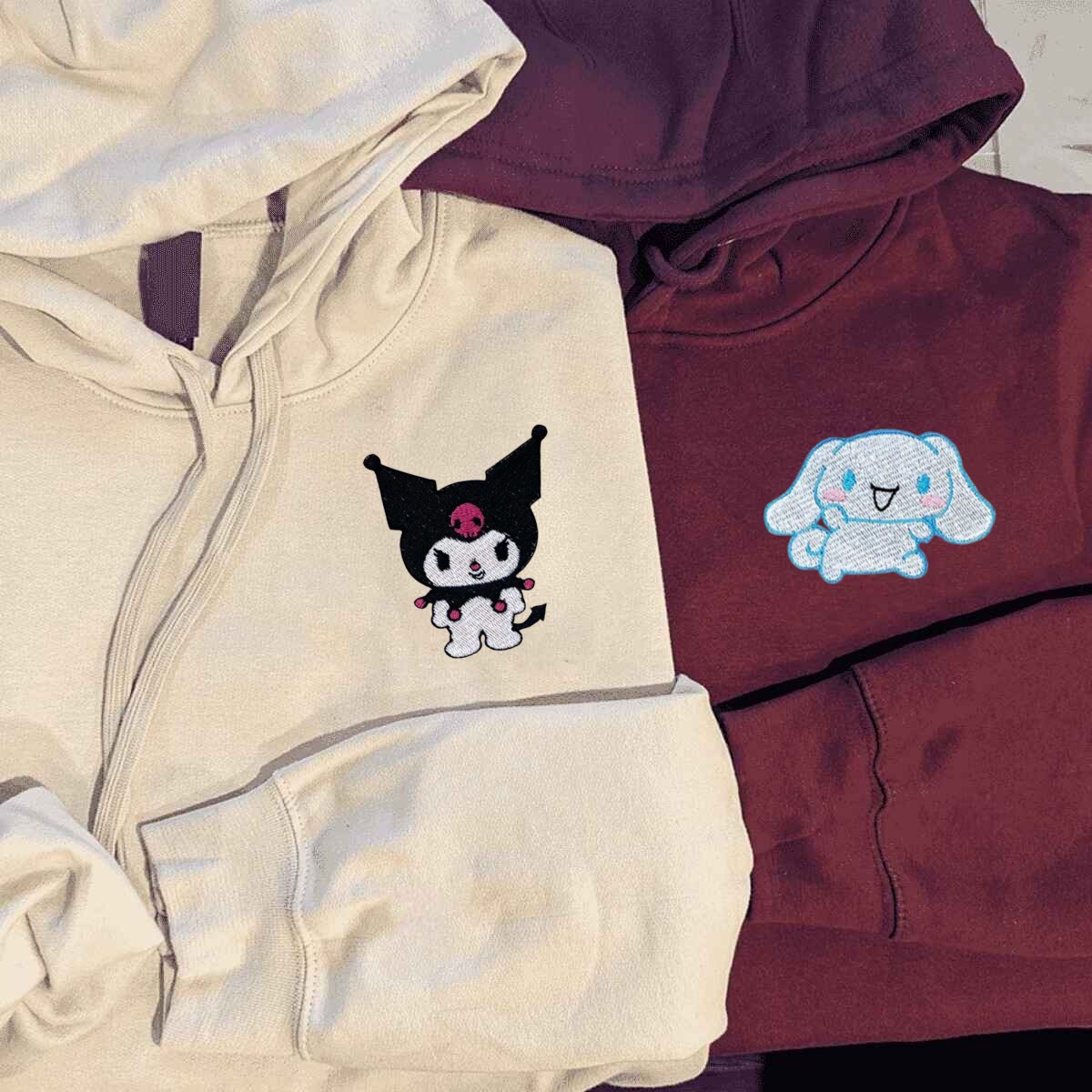 Playful and vibrant embroidered hoodies featuring cartoon characters for couples.