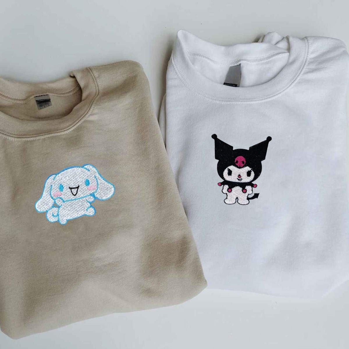 Matching couple hoodies with whimsical cartoon embroidery for playful couples.