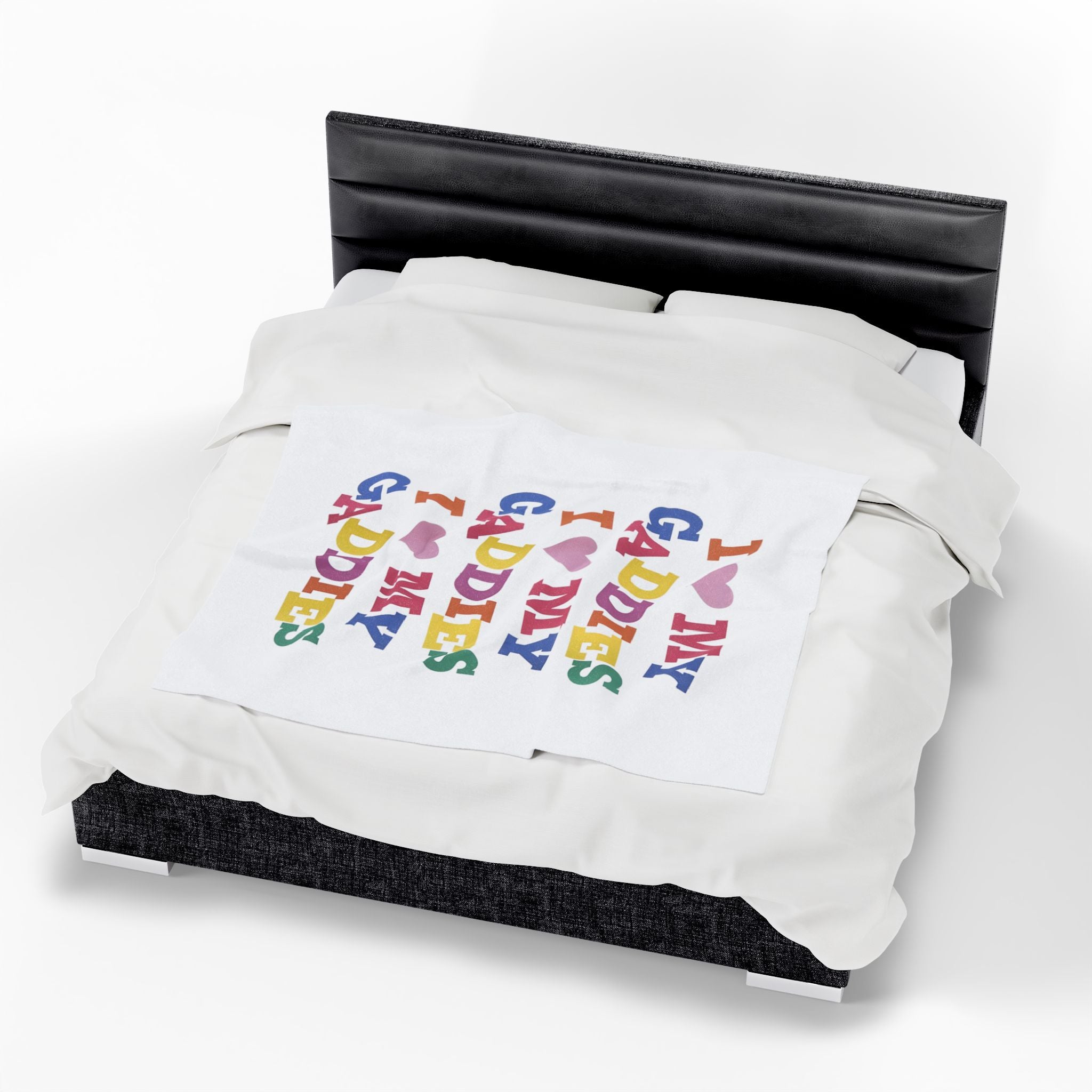 Colorful throw blanket on bed featuring bold rainbow text that says “I Love My Gaddies” – perfect LGBTQ+ gift for chosen family and pride celebrations.

