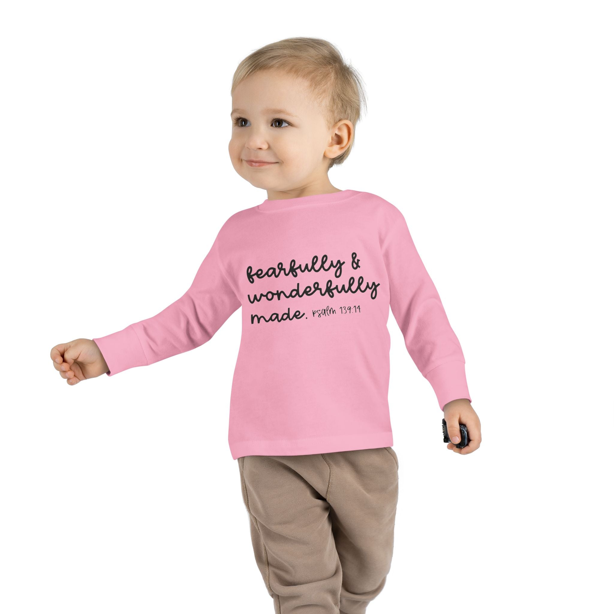 Toddler in pink scripture tee spreading joy and faith
