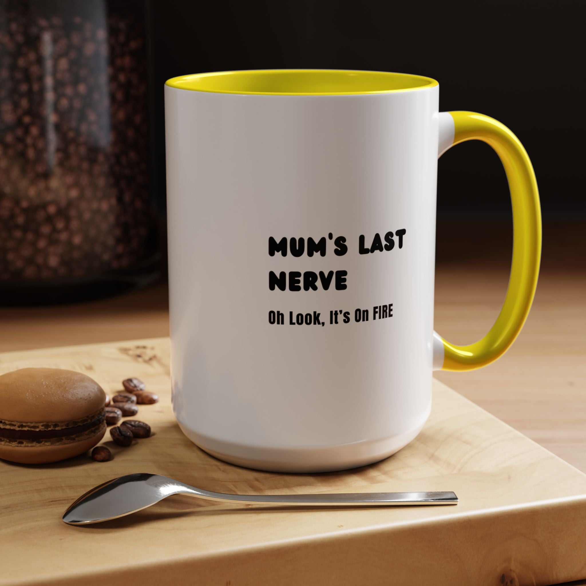 Mum's Last Nerve Ceramic Mug with Yellow Handle on Table