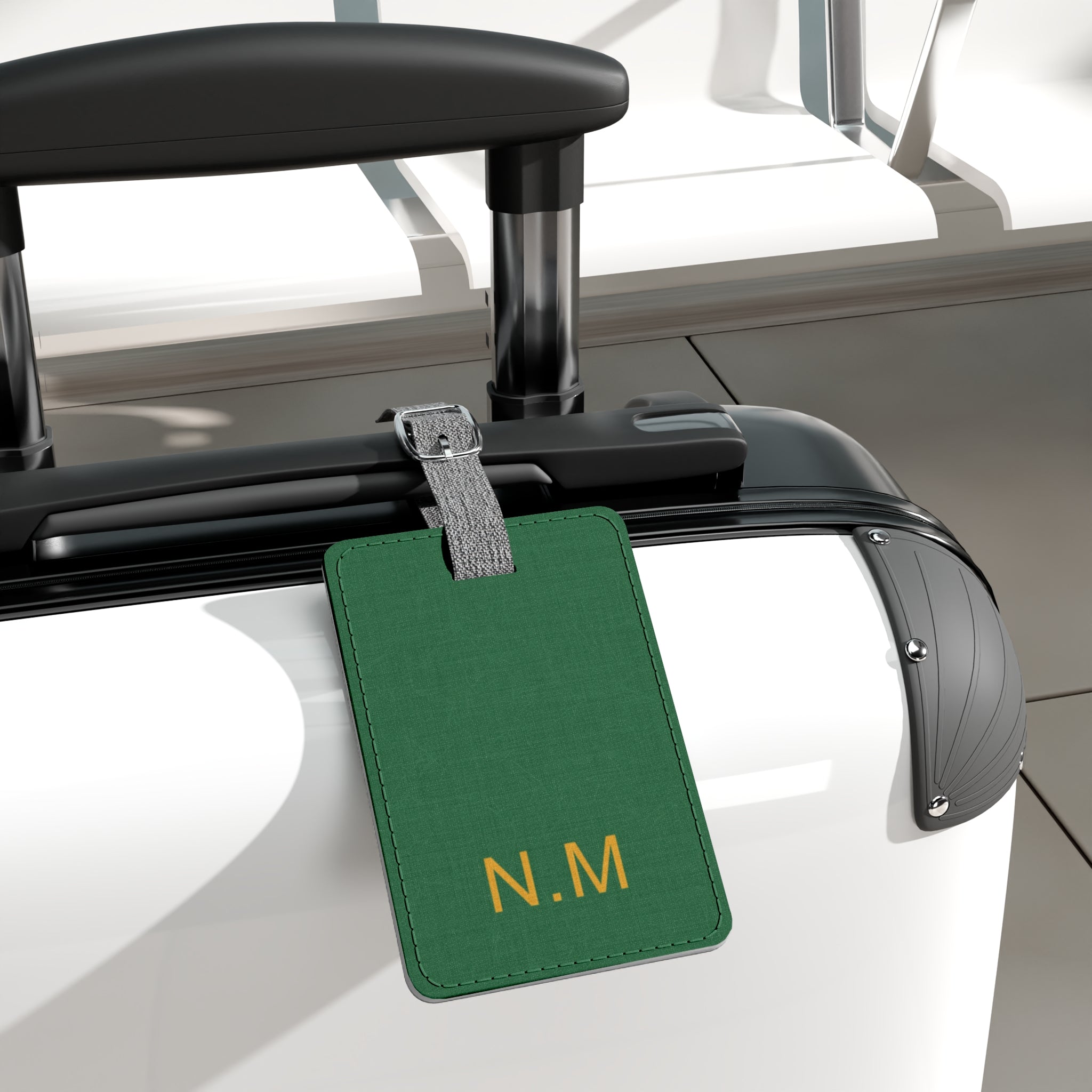 Green Saffiano polyester luggage tag attached to suitcase