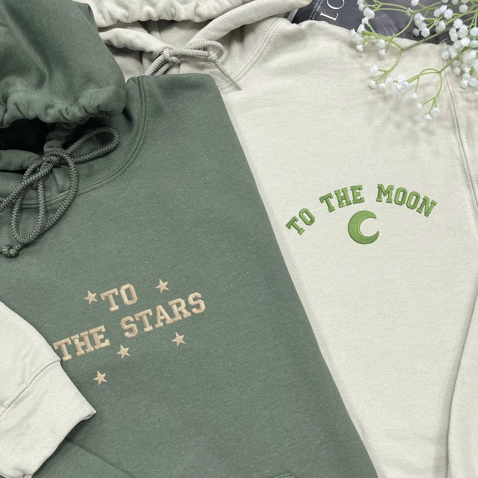 Matching couple hoodies with "To The Moon" and "To The Stars" embroidered designs.